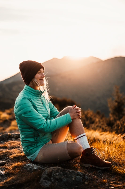 motivation therapy woman sitting hopeful in a beautiful sunny landscape